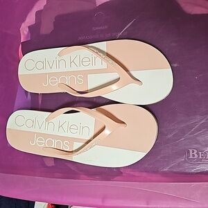 Size 9/10 Calvin Klein jeans pink and white flip flops.